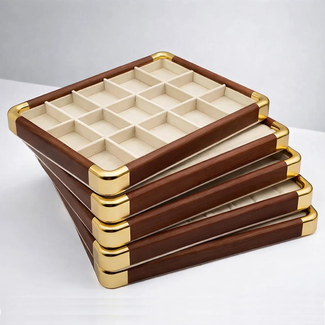 Stacked wooden compartment trays with gold corner details for premium jewelry organizer packaging