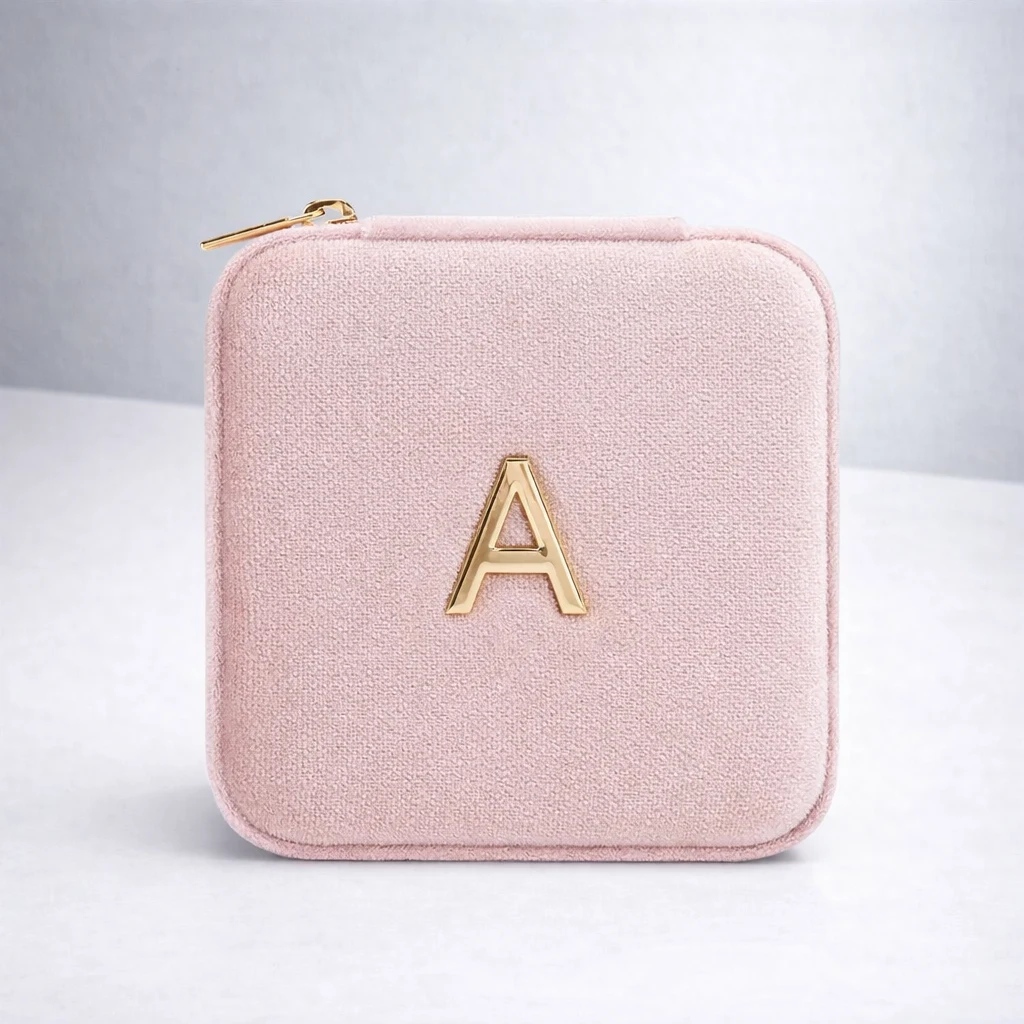 Pink velvet zip travel jewelry box with monogram-ready branding