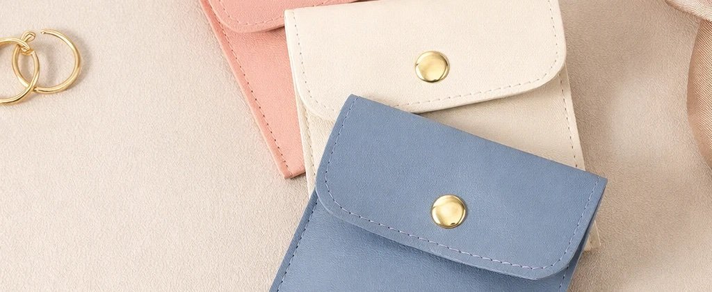Soft jewelry pouches in pastel colors for custom cosmetic bag and pouch programs