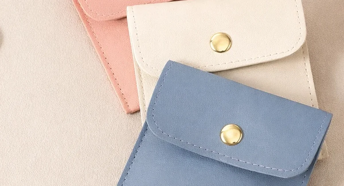 Custom Jewelry Boxes & Packaging Manufacturer | ShineStash Soft jewelry pouches in pastel colors without text overlay