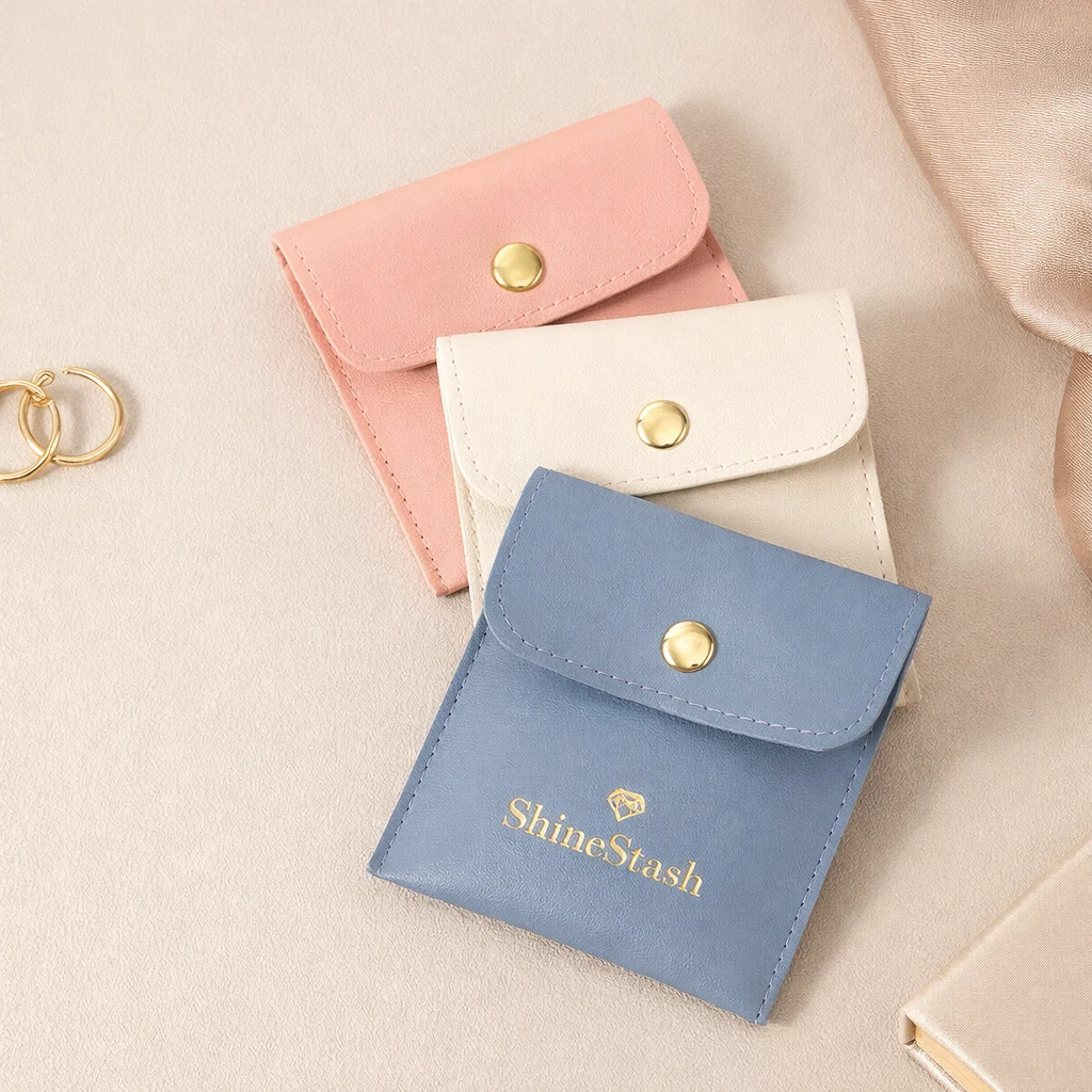 Custom Jewelry Pouches Wholesale | Logo Pouch Supplier Custom snap closure jewelry pouches with debossed logo and color options