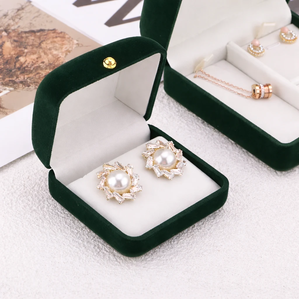 Green velvet earring jewelry boxes with soft cream lining for retail gifting